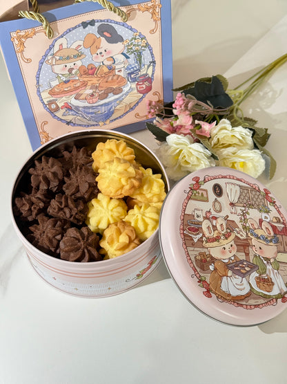 Decorative box with floral design on lid, containing assorted flowers.
