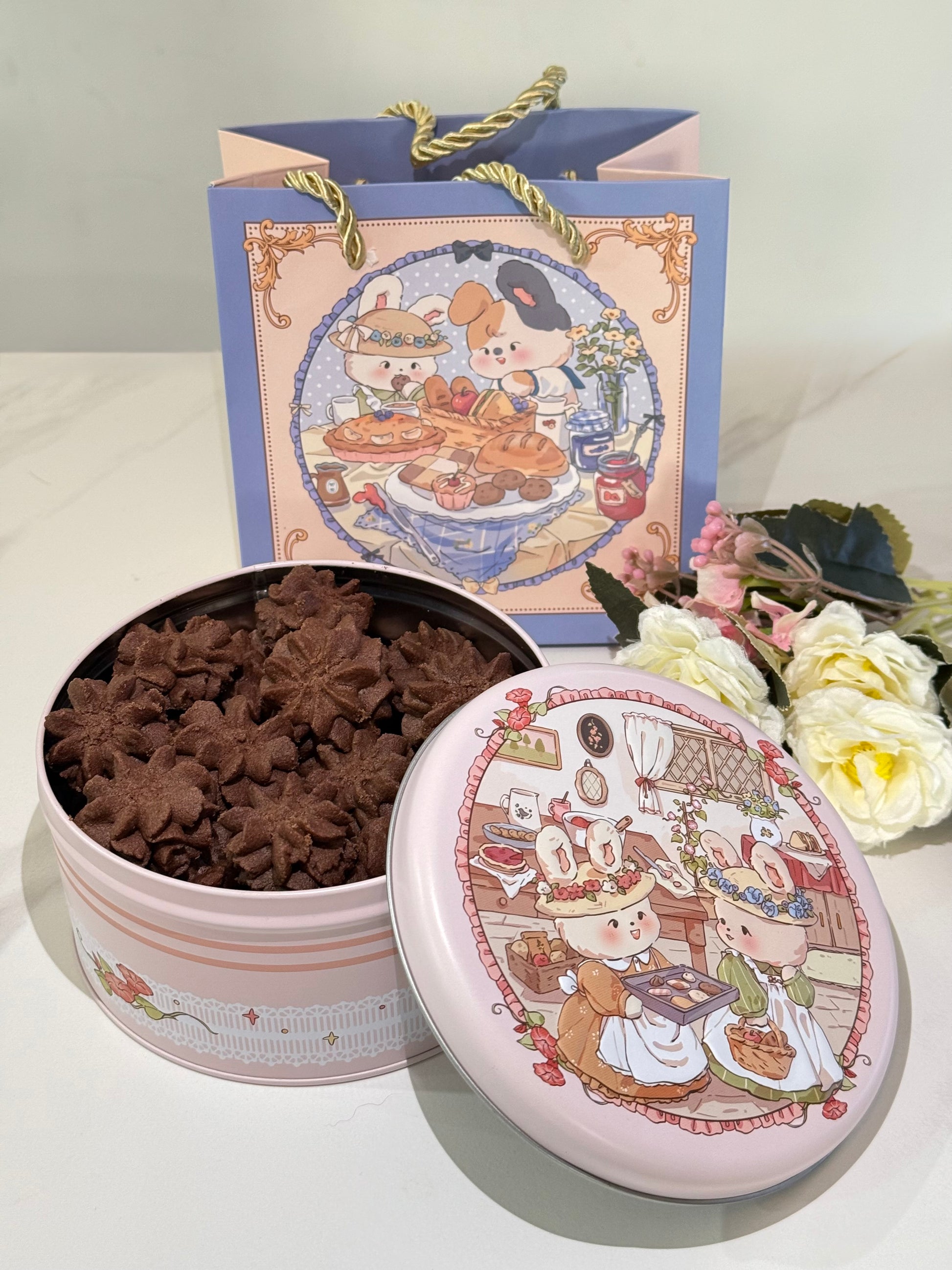 Decorative tin with star-shaped cookies and a matching lid featuring cartoon characters on a white surface.