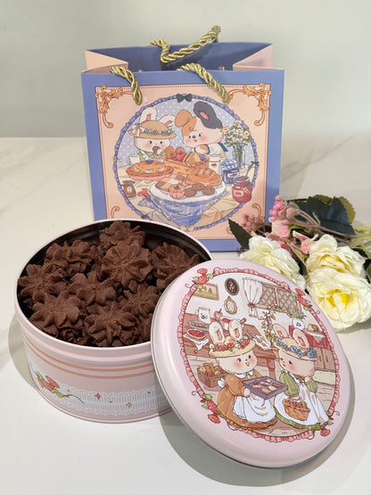 Decorative tin with star-shaped cookies and a matching lid featuring cartoon characters on a white surface.