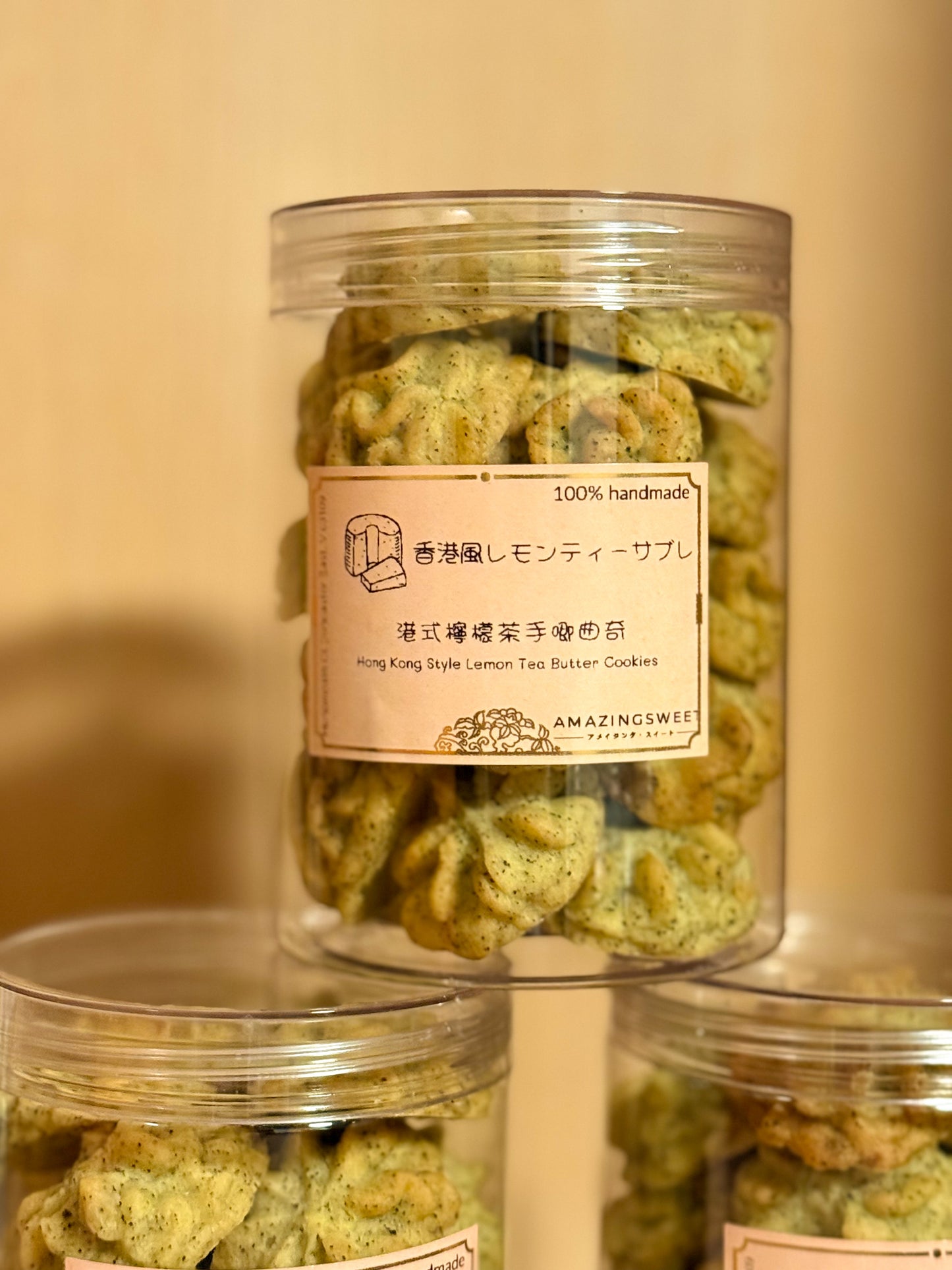 Jar of green cookies with a label on a beige background