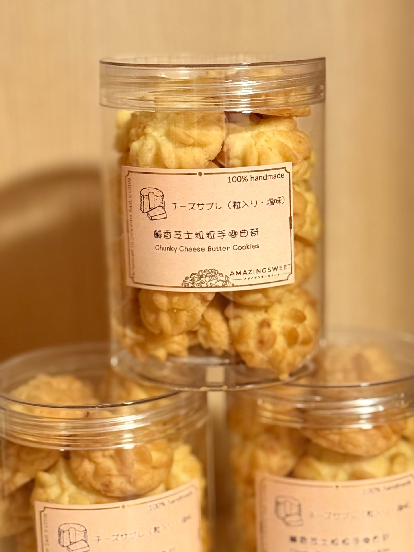 Jar of cheesy cookies with a label on a beige background